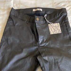 Black Leather like straight legged pants.